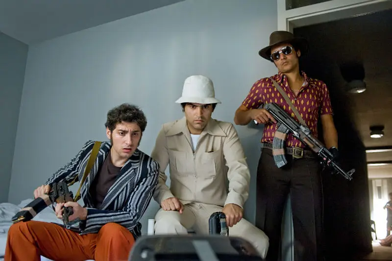 München 72 - Das Attentat: Three armed men in retro outfits in room